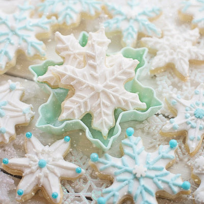 Sugared Snowflake flavored coffee sweet, warm buttery sugar cookie fresh from the oven. Image of frosted snowflake cookies 